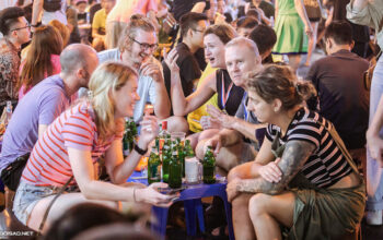 Foreigners drink beer at Ta Hien backpacker area in Hanoi's Old Quarter, 2022
